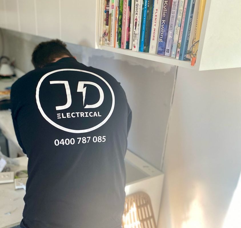 JD Electrical Group electrician at work in Newcastle